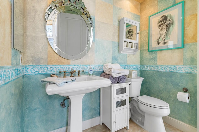 bathroom with tile patterned flooring and toilet