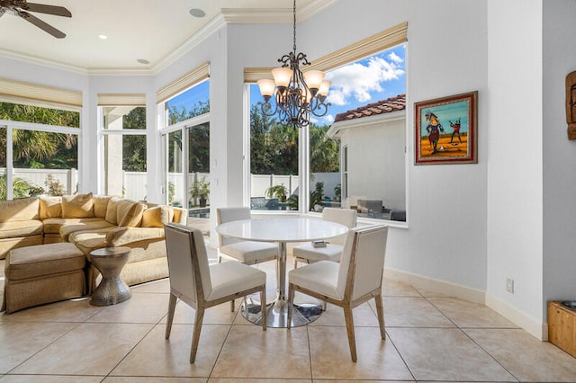 sunroom featuring ceiling fan with notable chandelier