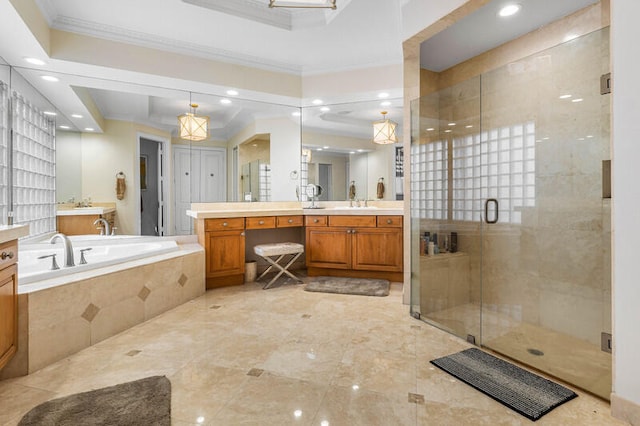 bathroom featuring separate shower and tub, a raised ceiling, vanity, and ornamental molding