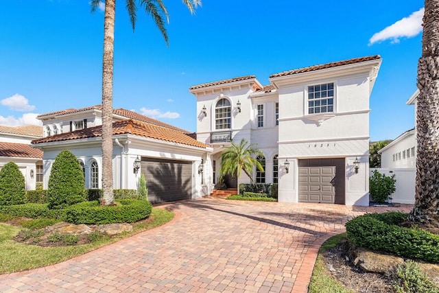 mediterranean / spanish-style house featuring a garage