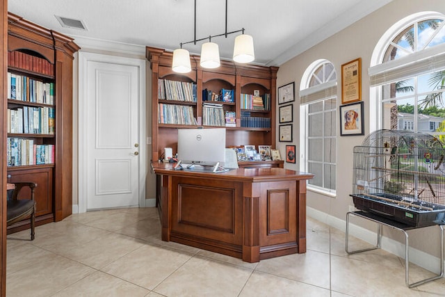 office area with light tile patterned floors and crown molding