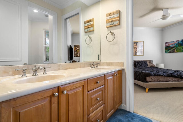 bathroom featuring vanity, ceiling fan, and ornamental molding