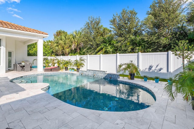 view of pool featuring a patio