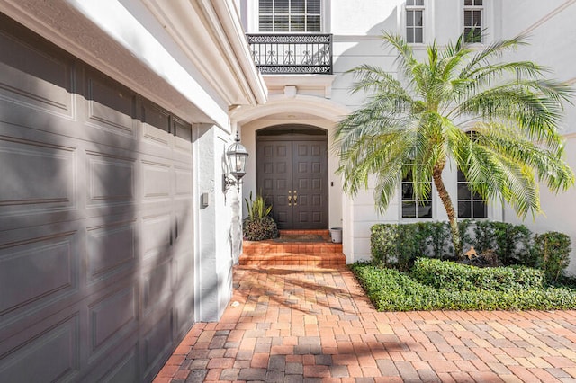 view of exterior entry featuring a garage