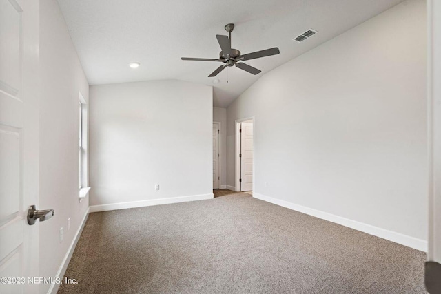 spare room featuring carpet flooring, ceiling fan, and lofted ceiling