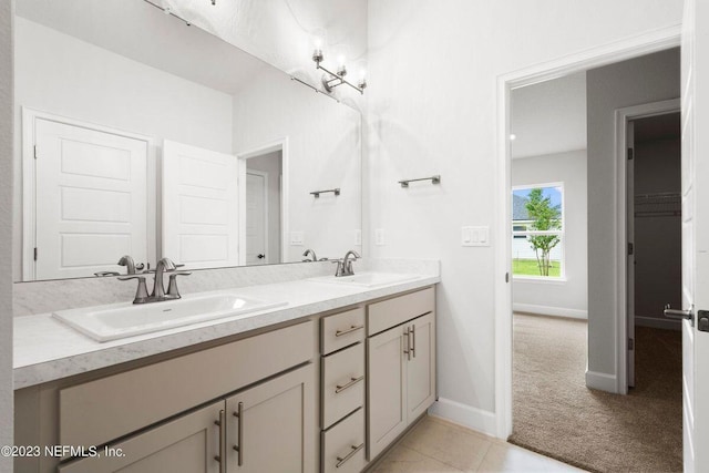 bathroom with tile patterned flooring and vanity