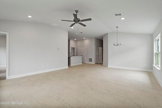 unfurnished living room featuring ceiling fan with notable chandelier and lofted ceiling