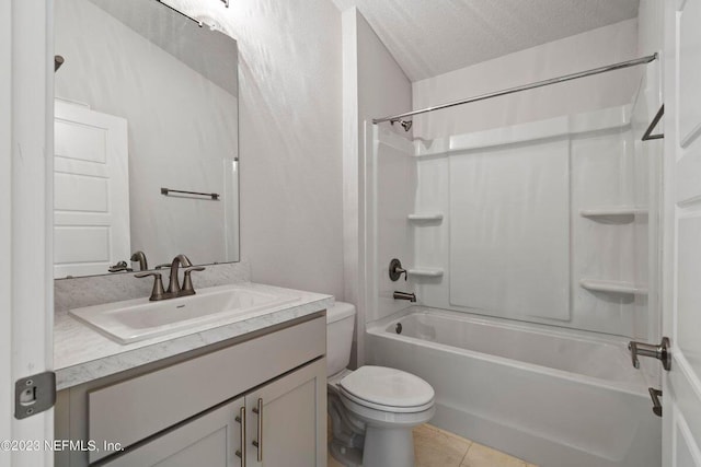 full bathroom featuring tile patterned flooring,  shower combination, a textured ceiling, toilet, and vanity