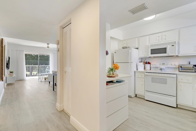 kitchen with dishwasher, white cabinets, dark wood-type flooring, and sink