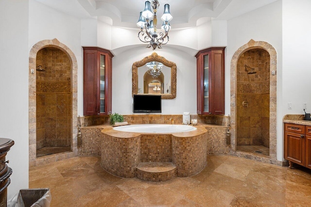 bathroom with vanity, a towering ceiling, and plus walk in shower