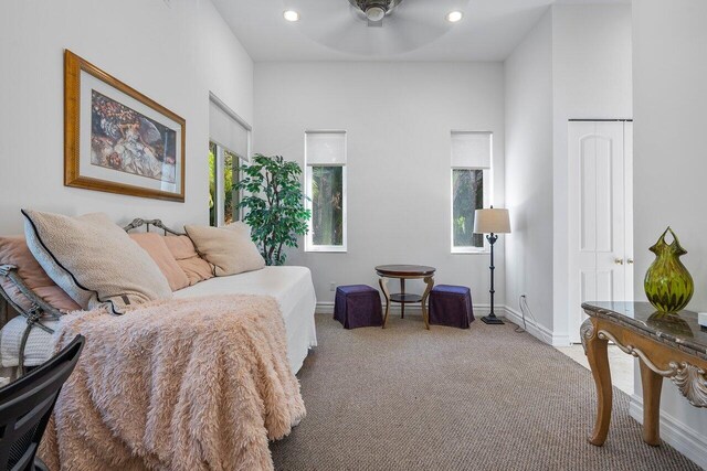 carpeted bedroom featuring ceiling fan