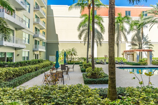 view of property's community with a patio and a pool