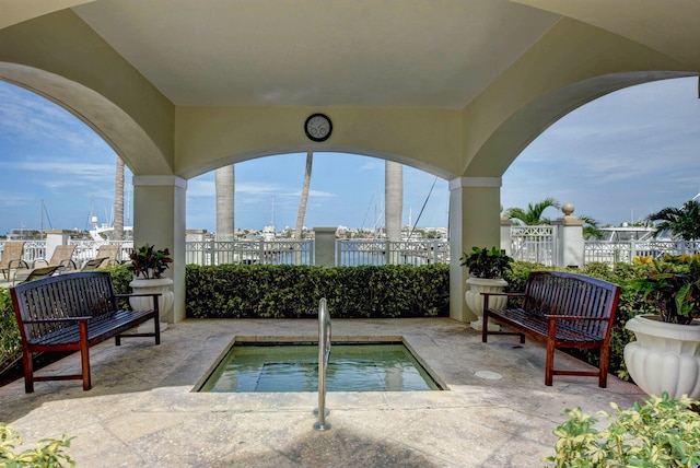 view of patio / terrace featuring a community hot tub