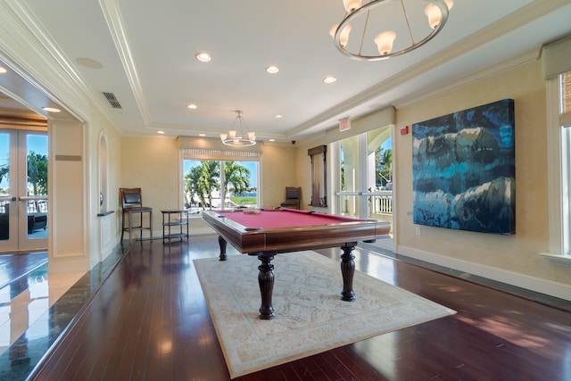 game room with french doors, billiards, ornamental molding, a tray ceiling, and dark hardwood / wood-style flooring