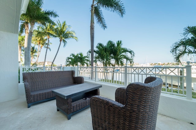 view of patio with a water view