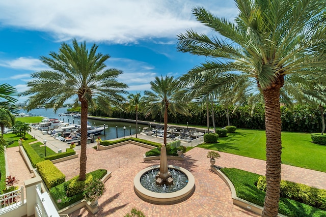 exterior space with a water view and a dock