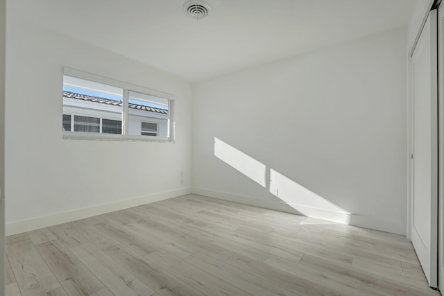 empty room with light wood-type flooring