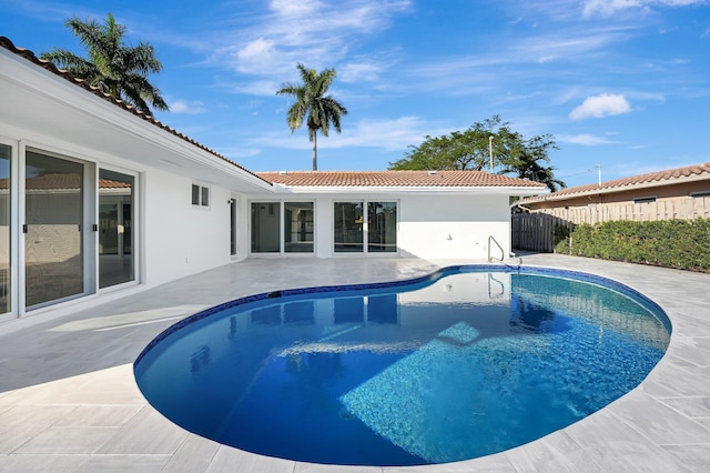 view of swimming pool with a patio