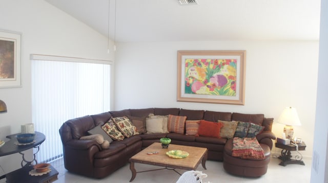 living room featuring vaulted ceiling