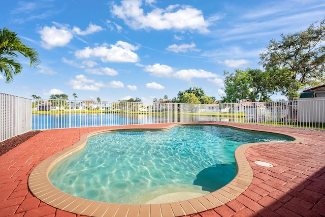 view of pool featuring a water view