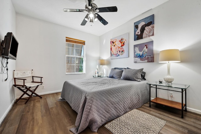 bedroom featuring dark hardwood / wood-style flooring and ceiling fan