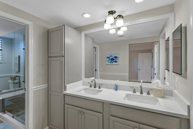 bathroom with vanity and walk in shower