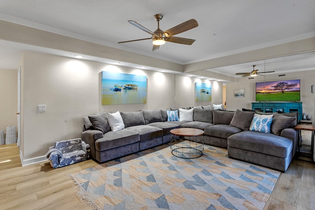 living room featuring ceiling fan, light hardwood / wood-style floors, and ornamental molding