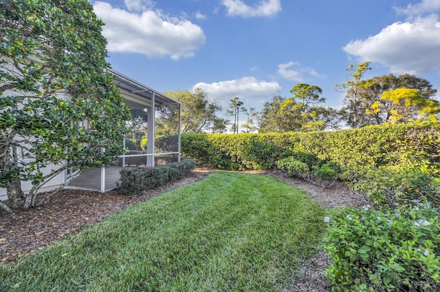 view of yard with a sunroom