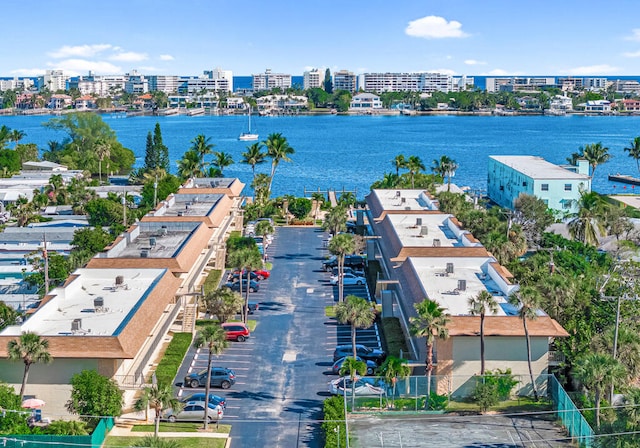 drone / aerial view featuring a view of city and a water view