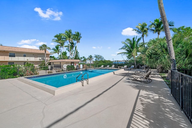 view of swimming pool with a patio