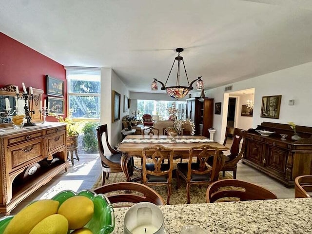 dining space with an inviting chandelier