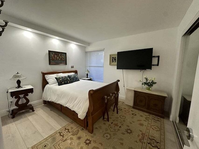 bedroom with light hardwood / wood-style flooring