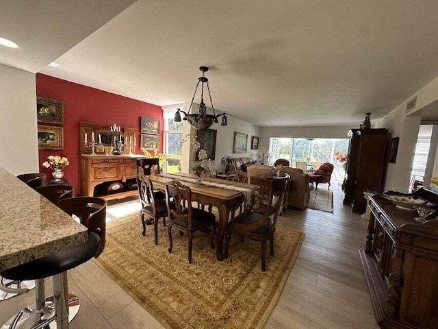 dining space featuring hardwood / wood-style floors