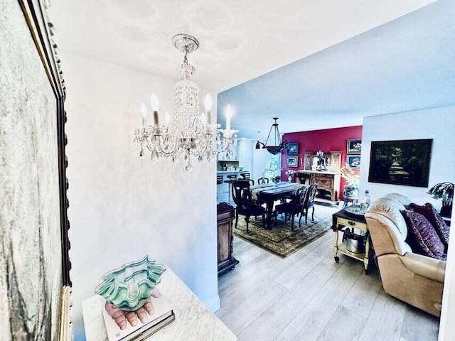 living room featuring a chandelier and hardwood / wood-style flooring