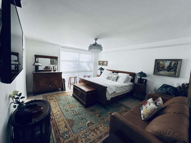 bedroom featuring a chandelier