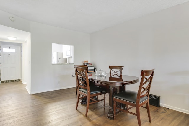 dining room featuring wood-type flooring