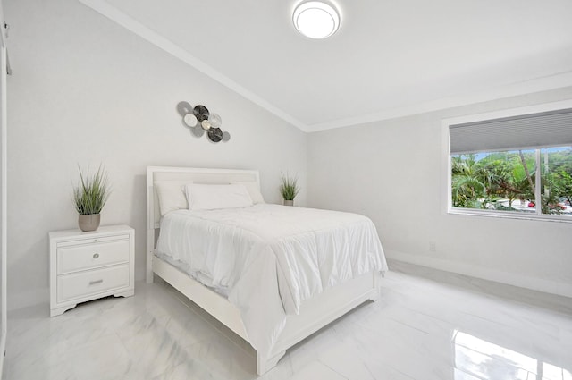 bedroom with ornamental molding and vaulted ceiling