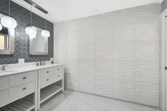 bathroom featuring vanity and tile walls