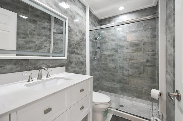 bathroom with vanity, an enclosed shower, and toilet