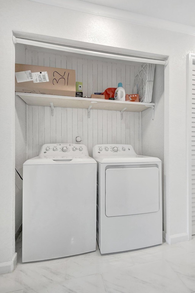 clothes washing area with independent washer and dryer