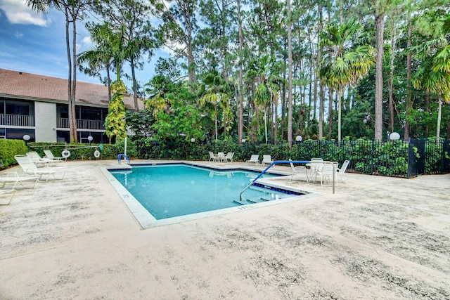 view of pool featuring a patio