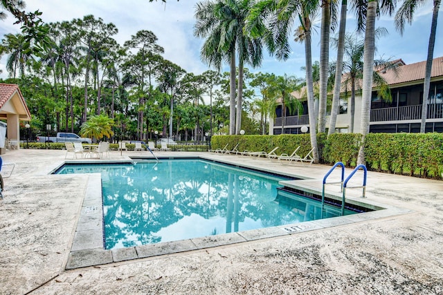 view of pool featuring a patio