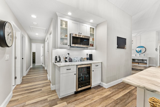 kitchen featuring white cabinets, a kitchen island, and appliances with stainless steel finishes