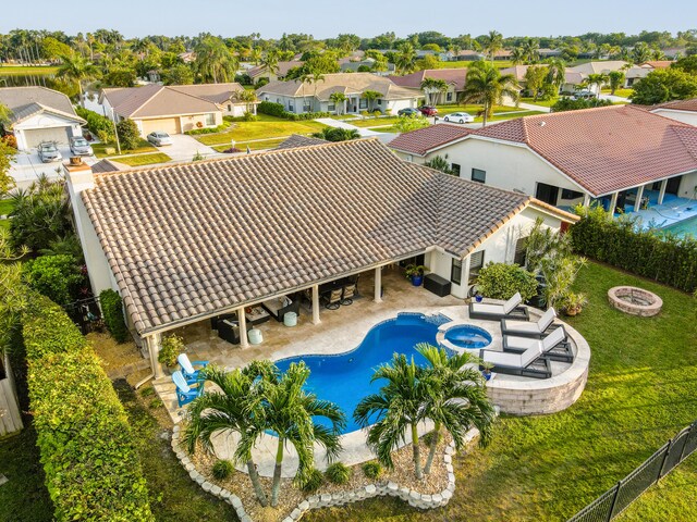 view of swimming pool with a yard, an outdoor fire pit, and a patio area