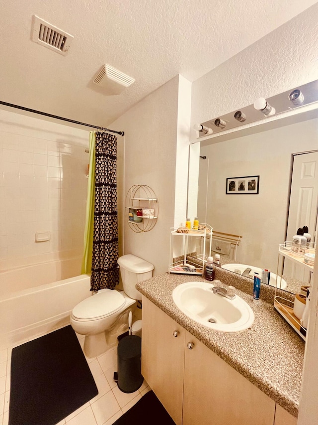 full bath featuring visible vents, toilet, a textured ceiling, shower / tub combo, and vanity