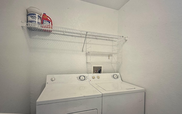 laundry room with washer and clothes dryer and laundry area