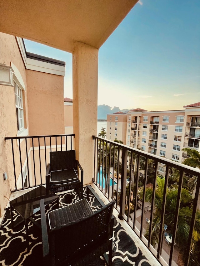 view of balcony at dusk