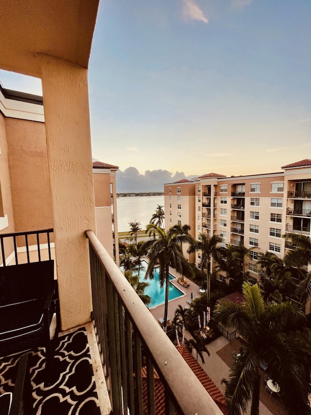 balcony at dusk with a water view