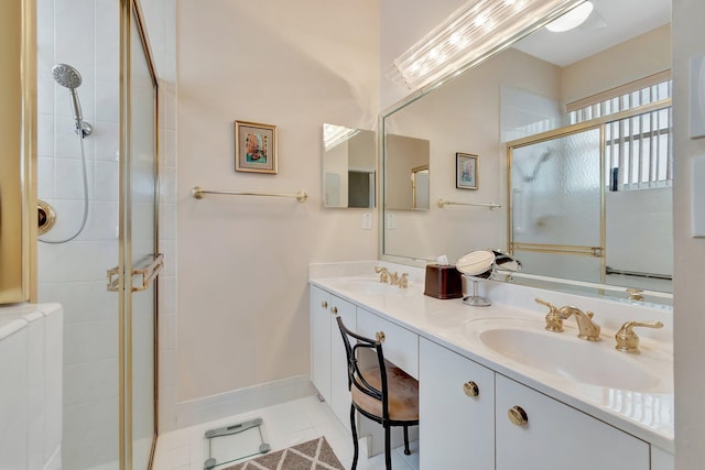 bathroom featuring vanity, a shower with shower door, and tile patterned floors