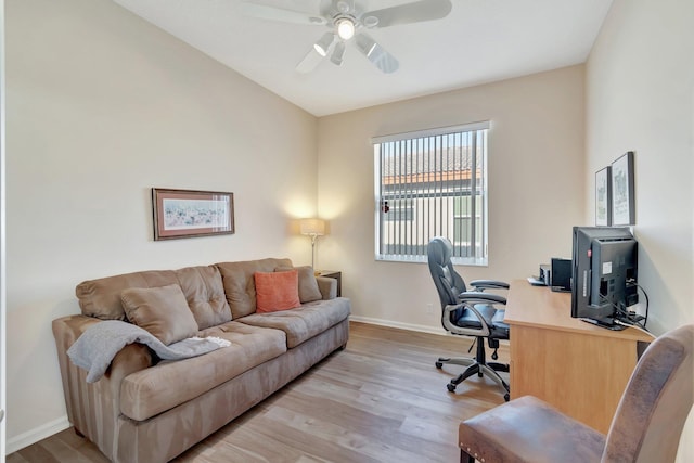 office space featuring ceiling fan and light hardwood / wood-style floors